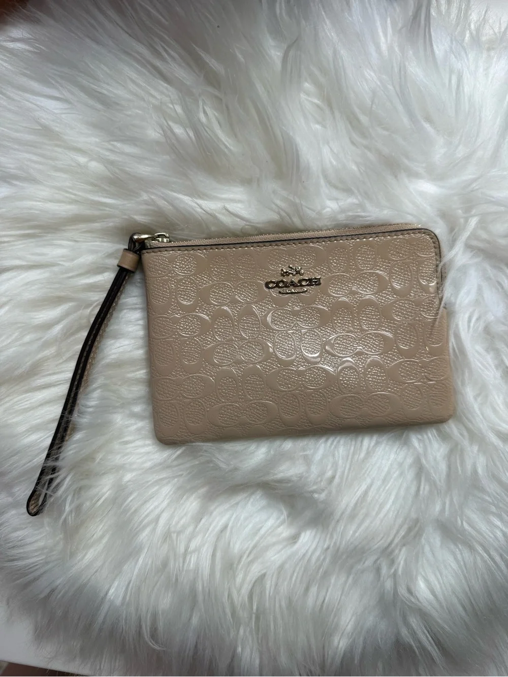 COACH Embossed Signature Wristlet in Neutral Beige